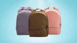 Three backpacks in purple, brown, and pink displayed against a light blue background