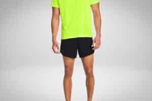 Person wearing a bright neon yellow shirt and black athletic shorts, standing against a plain background.